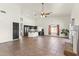 Open-concept living space with tiled flooring, modern kitchen, and a cozy fireplace, great for gatherings at 351 N Danyell Dr, Chandler, AZ 85225