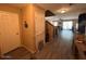 Entryway featuring neutral paint colors, wood floors and a staircase at 41228 W Little Dr, Maricopa, AZ 85138