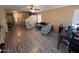 Spacious living room featuring wood floors, large windows and neutral paint colors at 41228 W Little Dr, Maricopa, AZ 85138