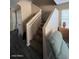 Carpeted staircase featuring neutral paint and a window at 41228 W Little Dr, Maricopa, AZ 85138
