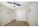 Bedroom with sliding closet doors, overhead lighting, neutral walls, and plush carpet flooring at 43822 W Baker Dr, Maricopa, AZ 85138