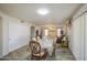 Dining area featuring a table set for six that sits adjacent to the living area at 43822 W Baker Dr, Maricopa, AZ 85138