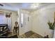 Bright entryway with a white front door, wood-look floors, and neutral walls at 43822 W Baker Dr, Maricopa, AZ 85138
