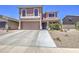 Charming two-story home with a two-car garage and desert landscaping in a well-maintained community at 43822 W Baker Dr, Maricopa, AZ 85138