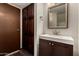 Bathroom vanity with contemporary sink, mirror, and dark cabinets for storage at 4630 N 68Th St # 264, Scottsdale, AZ 85251