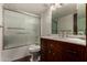 Bathroom featuring a vanity with marble countertop, under sink storage and shower at 4630 N 68Th St # 264, Scottsdale, AZ 85251