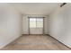 Bright bedroom with neutral carpeting and ample natural light from the window at 4630 N 68Th St # 264, Scottsdale, AZ 85251