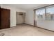 Bedroom featuring neutral carpet, an ample closet, and bright natural light at 4630 N 68Th St # 264, Scottsdale, AZ 85251