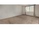 Bright bedroom with neutral carpeting and ample natural light from the window at 4630 N 68Th St # 264, Scottsdale, AZ 85251