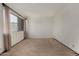 Spacious bedroom featuring neutral carpet, bright natural light, and window coverings at 4630 N 68Th St # 264, Scottsdale, AZ 85251