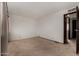 Bedroom featuring neutral carpeting and an open doorway to the hallway at 4630 N 68Th St # 264, Scottsdale, AZ 85251