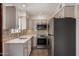 Updated kitchen featuring stainless steel appliances, light countertops, and a mosaic backsplash at 4630 N 68Th St # 264, Scottsdale, AZ 85251