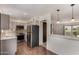 Kitchen featuring stainless steel appliances, and an open concept layout with views into the living area at 4630 N 68Th St # 264, Scottsdale, AZ 85251