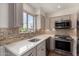 Bright kitchen featuring stainless steel appliances, stylish cabinets, and lots of natural light at 4630 N 68Th St # 264, Scottsdale, AZ 85251