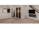 Bright living room with a modern fireplace and adjacent kitchen view at 4630 N 68Th St # 264, Scottsdale, AZ 85251