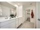Modern bathroom features a double vanity, large mirror, and neutral color palette at 4792 E Shasta Dr, San Tan Valley, AZ 85143