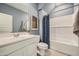 Bathroom with blue walls featuring a tub, vanity, and framed wall art at 4792 E Shasta Dr, San Tan Valley, AZ 85143