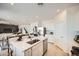 The kitchen features stainless steel appliances, a center island, and an open layout at 4792 E Shasta Dr, San Tan Valley, AZ 85143