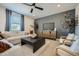 Living room boasts a neutral palette, ceiling fan and stylish furnishings at 4792 E Shasta Dr, San Tan Valley, AZ 85143