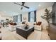 The open-concept living room is furnished with neutral colors and has a ceiling fan at 4792 E Shasta Dr, San Tan Valley, AZ 85143