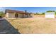 Expansive backyard featuring a covered patio, storage shed, and plenty of space at 4845 W Evans Dr, Glendale, AZ 85306