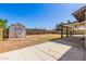 Spacious backyard with a covered patio, storage shed, and ample space at 4845 W Evans Dr, Glendale, AZ 85306