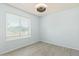 Bright bedroom with tile floor, ceiling fan, and horizontal blinds at 4845 W Evans Dr, Glendale, AZ 85306