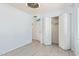 Neutral bedroom with tile floor and folding closet door at 4845 W Evans Dr, Glendale, AZ 85306