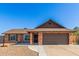 Charming single-story brick home featuring a two-car garage and well-maintained front yard at 4845 W Evans Dr, Glendale, AZ 85306