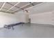 Spacious two-car garage with epoxy floors, overhead door opener, and water heater at 4845 W Evans Dr, Glendale, AZ 85306