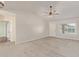 Open-concept living room featuring wood-look tile flooring, vaulted ceilings, and abundant natural light at 4845 W Evans Dr, Glendale, AZ 85306
