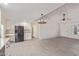 Open-concept space with tile floors connecting living and dining areas to an updated kitchen at 4845 W Evans Dr, Glendale, AZ 85306
