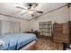Comfortable bedroom featuring durable flooring and a ceiling fan at 49478 W Val Vista Rd, Maricopa, AZ 85139
