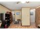 Bedroom highlighting wood-look floors, a ceiling fan, and open doorway at 49478 W Val Vista Rd, Maricopa, AZ 85139