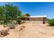 Single-story desert home with gravel landscaping, native vegetation, and a covered porch at 49478 W Val Vista Rd, Maricopa, AZ 85139