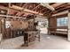 View of a garage with workbenches and door to the outside at 49478 W Val Vista Rd, Maricopa, AZ 85139