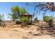 Wooden gazebo surrounded by gravel landscaping, complemented by desert vegetation at 49478 W Val Vista Rd, Maricopa, AZ 85139