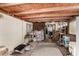 View of a disorganized patio featuring a wood ceiling and access to the yard at 49478 W Val Vista Rd, Maricopa, AZ 85139