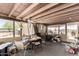 View of a disorganized covered patio featuring a ceiling fan and view to the yard at 49478 W Val Vista Rd, Maricopa, AZ 85139