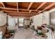 View of a disorganized patio featuring a wood ceiling and access to the yard at 49478 W Val Vista Rd, Maricopa, AZ 85139