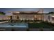 Modern home's architectural details are highlighted by its water feature and manicured landscaping at 6525 E Bluebird Ln, Paradise Valley, AZ 85253