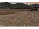 A vast vacant lot with the mountains serving as an idyllic backdrop at 6525 E Bluebird Ln, Paradise Valley, AZ 85253