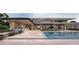 Inviting backyard featuring a modern pool, outdoor kitchen and lounge area, perfect for entertaining at 6525 E Bluebird Ln, Paradise Valley, AZ 85253