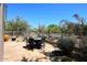 Landscaped backyard featuring desert landscaping and an outdoor dining area at 6966 E Bramble Berry Ln, Scottsdale, AZ 85266