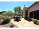 Backyard patio with flagstone, dining table, desert landscaping and views at 6966 E Bramble Berry Ln, Scottsdale, AZ 85266