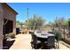 Backyard patio with stone and built-in grill, desert landscaping and views at 6966 E Bramble Berry Ln, Scottsdale, AZ 85266