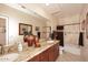 Bathroom featuring double sinks, granite countertops, a large mirror, and a bath with a curtain at 6966 E Bramble Berry Ln, Scottsdale, AZ 85266