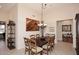 Elegant dining room features tile flooring, neutral walls, and chandelier lighting at 6966 E Bramble Berry Ln, Scottsdale, AZ 85266