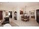 Open floor plan with elegant dining room and access to the living room at 6966 E Bramble Berry Ln, Scottsdale, AZ 85266