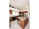 Kitchen with granite counters, island with breakfast bar and stainless steel appliances at 6966 E Bramble Berry Ln, Scottsdale, AZ 85266